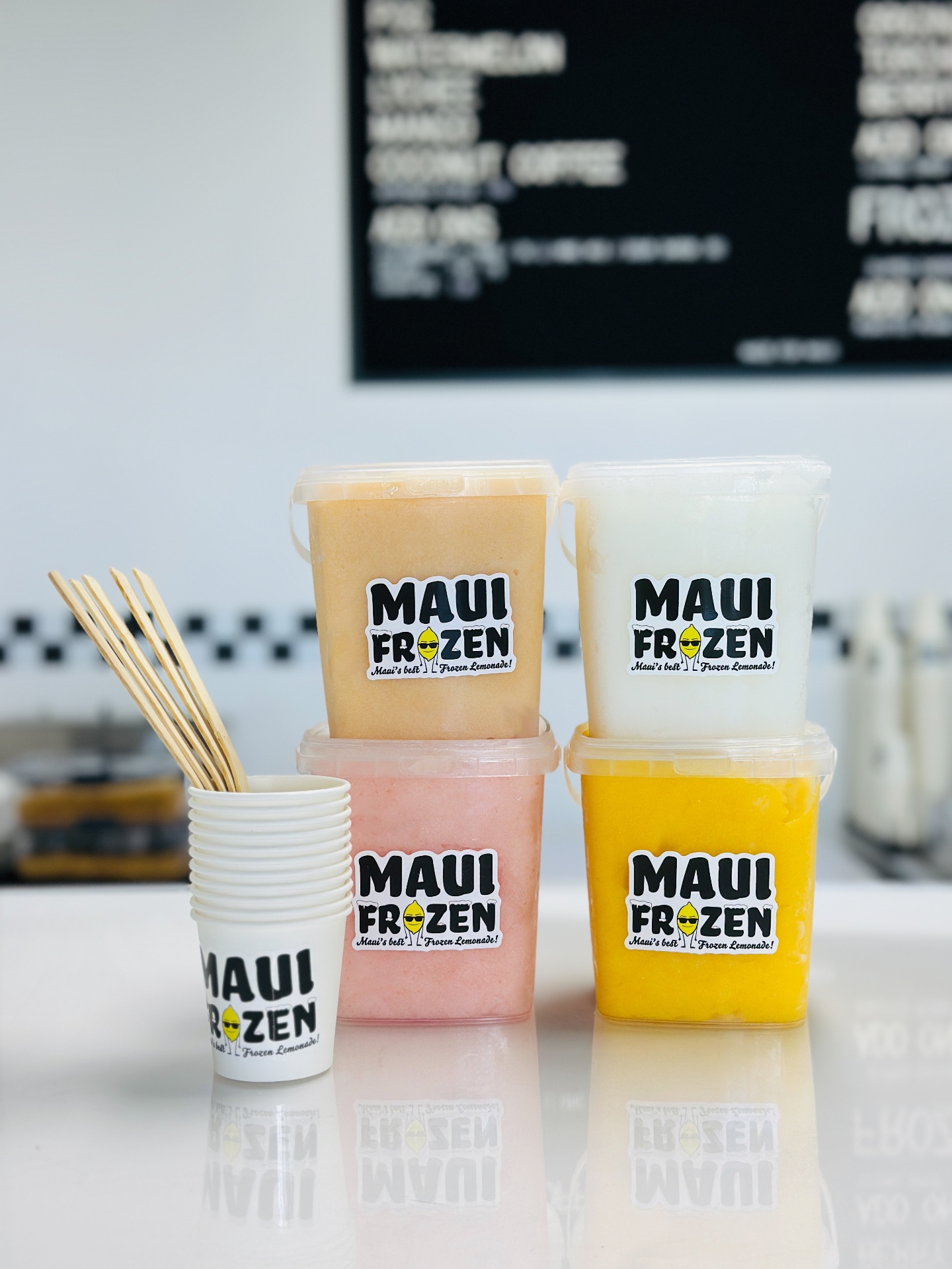 Maui Frozen cups and pints lined up on the counter