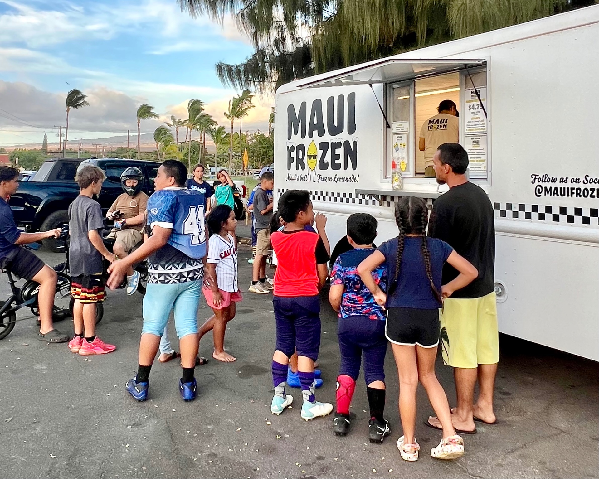 Guests gathered around the Maui Frozen truck